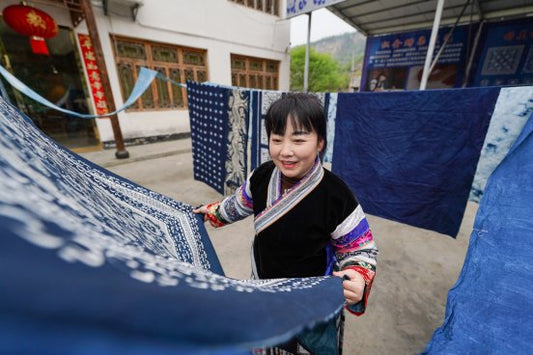 Miao batik indigo fabric drying as part of the handmade wax-resist process