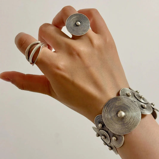 Handcrafted Miao silver open cuff bracelet and filigree ring styled with a neutral top
