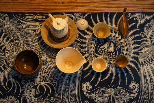 Miao batik table runner styled with ethnic textile decor in a modern home