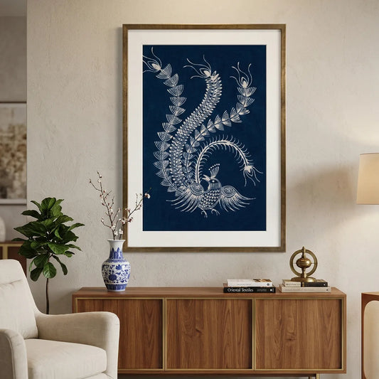 Framed Miao Batik artwork of a stylized Phoenix on a blue background in a living room setting.