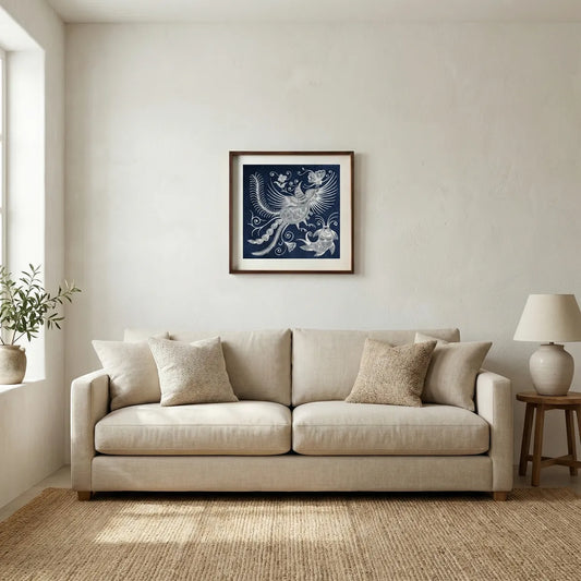Beige sofa in a living room with a framed Miao batik artwork on the wall.