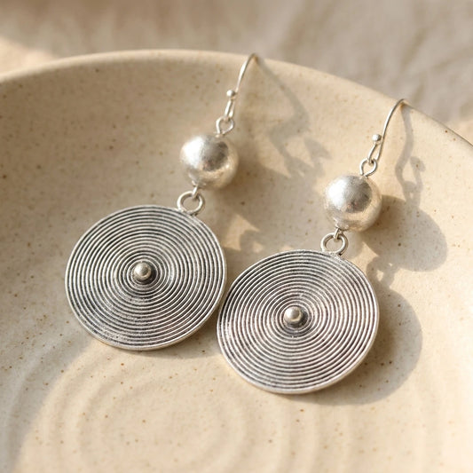 Miao Silver Round Disc Earrings – Small Drop on a light background