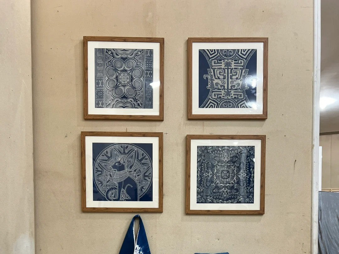 Small framed Miao batik pieces arranged as meaningful cultural gifts