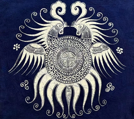 Circular Miao batik bird motif with dense white linework on indigo cloth