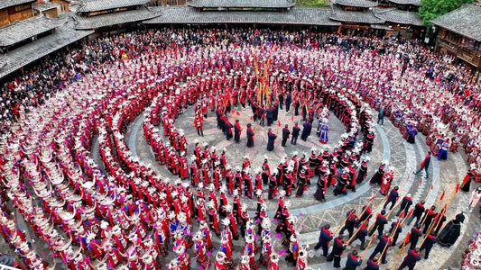 Large Miao New Year celebration with silver dress and circle formation in Guizhou