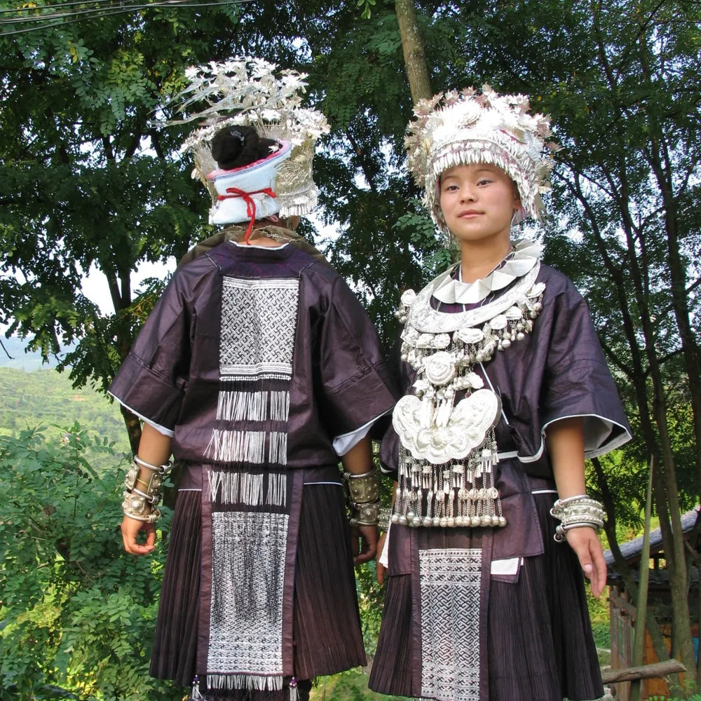 Traditional Miao dress with silver ornaments and embroidered detail