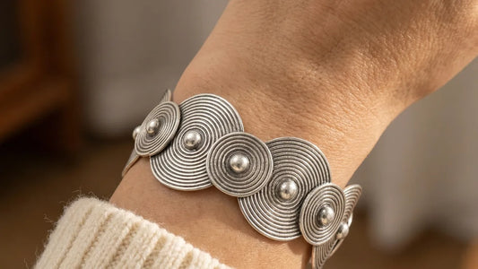 Model wearing bold handcrafted statement silver jewelry styled with modern bohemian attire 16:9 banner