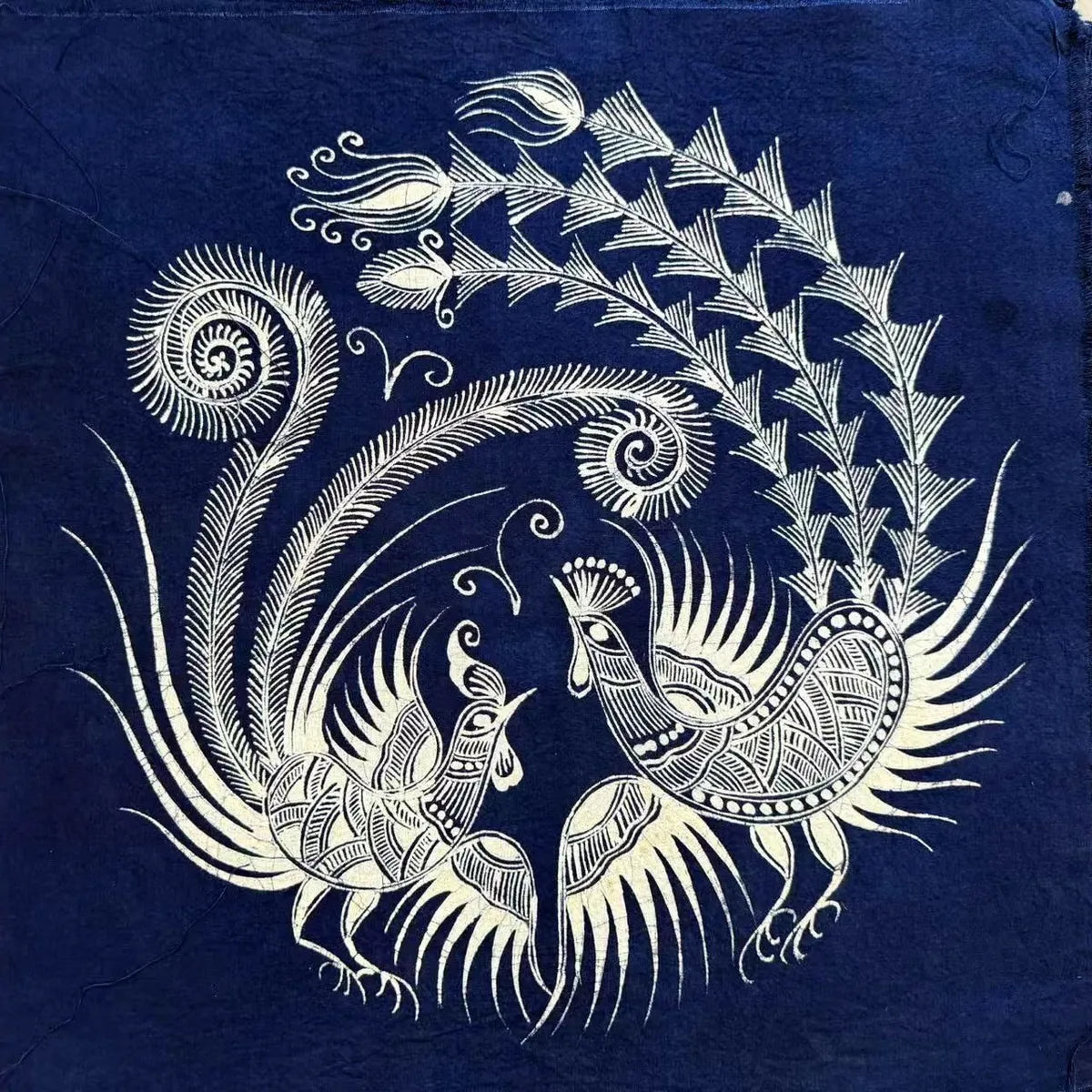 Decorative design of peacocks on a blue background