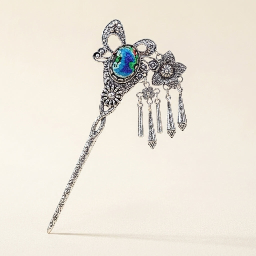 Miao silver embroidery hair stick with a blue floral centerpiece and silver ornaments