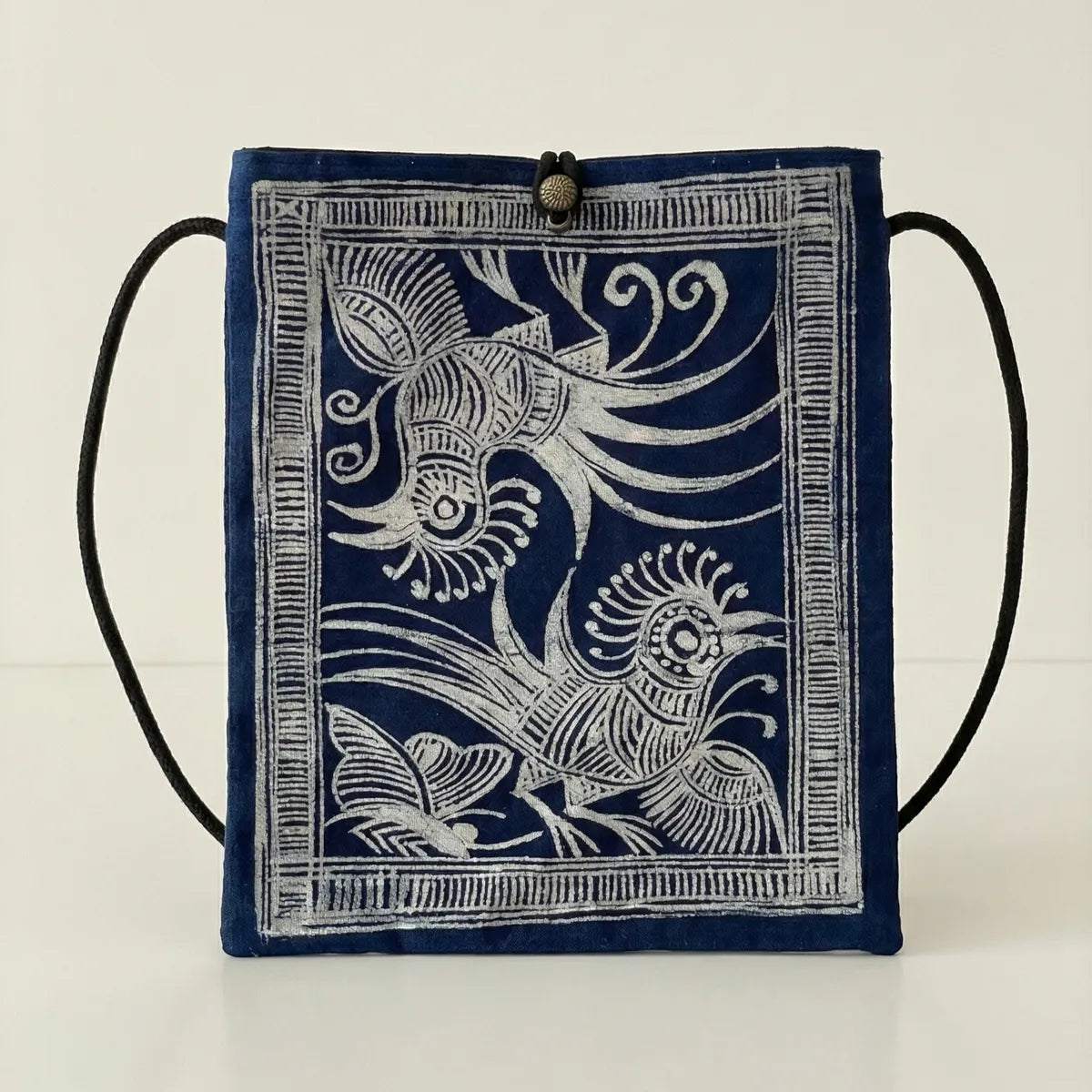 Miao batik bag with white bird design on a white background