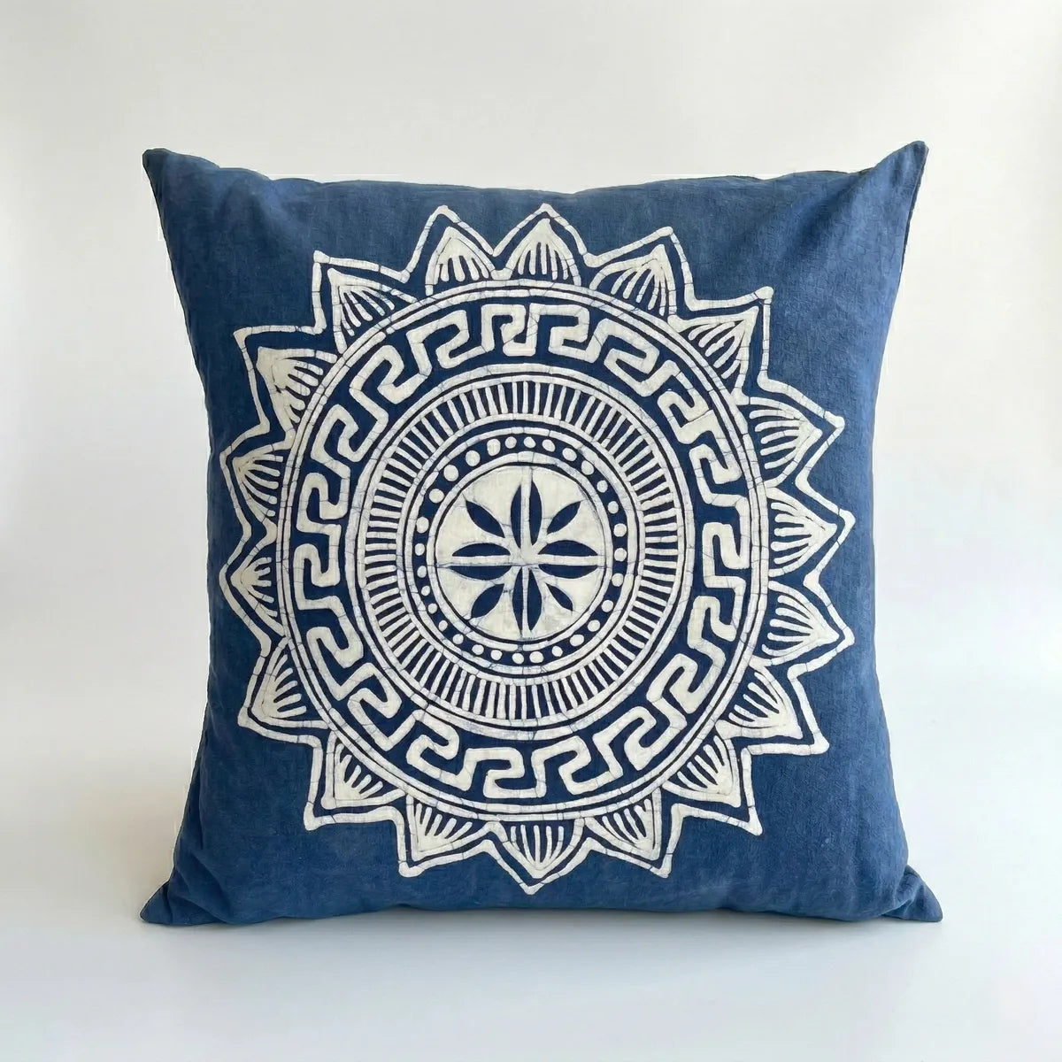 Miao batik pillow with white geometric pattern on a white background