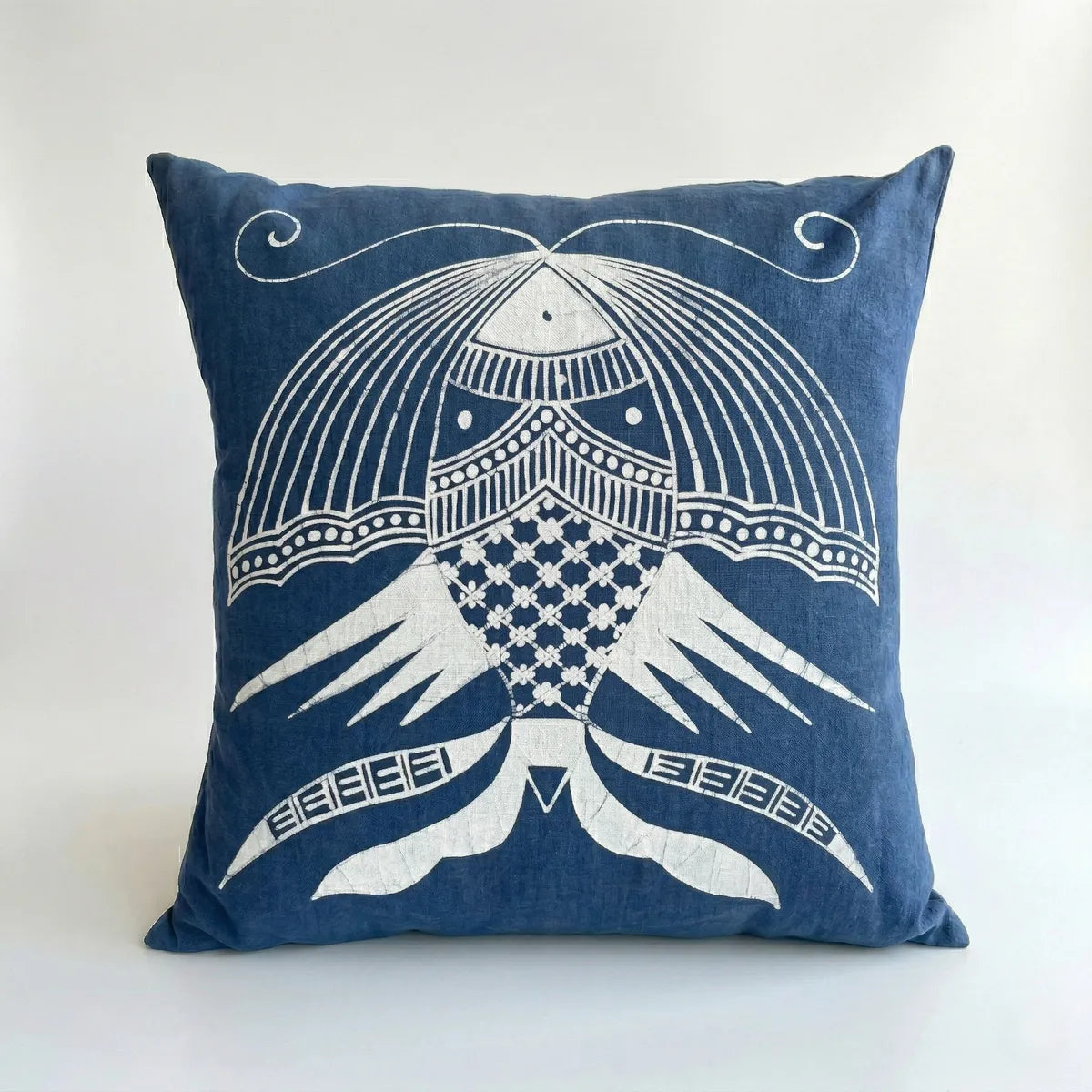 Miao batik pillow with white decorative pattern on a white background
