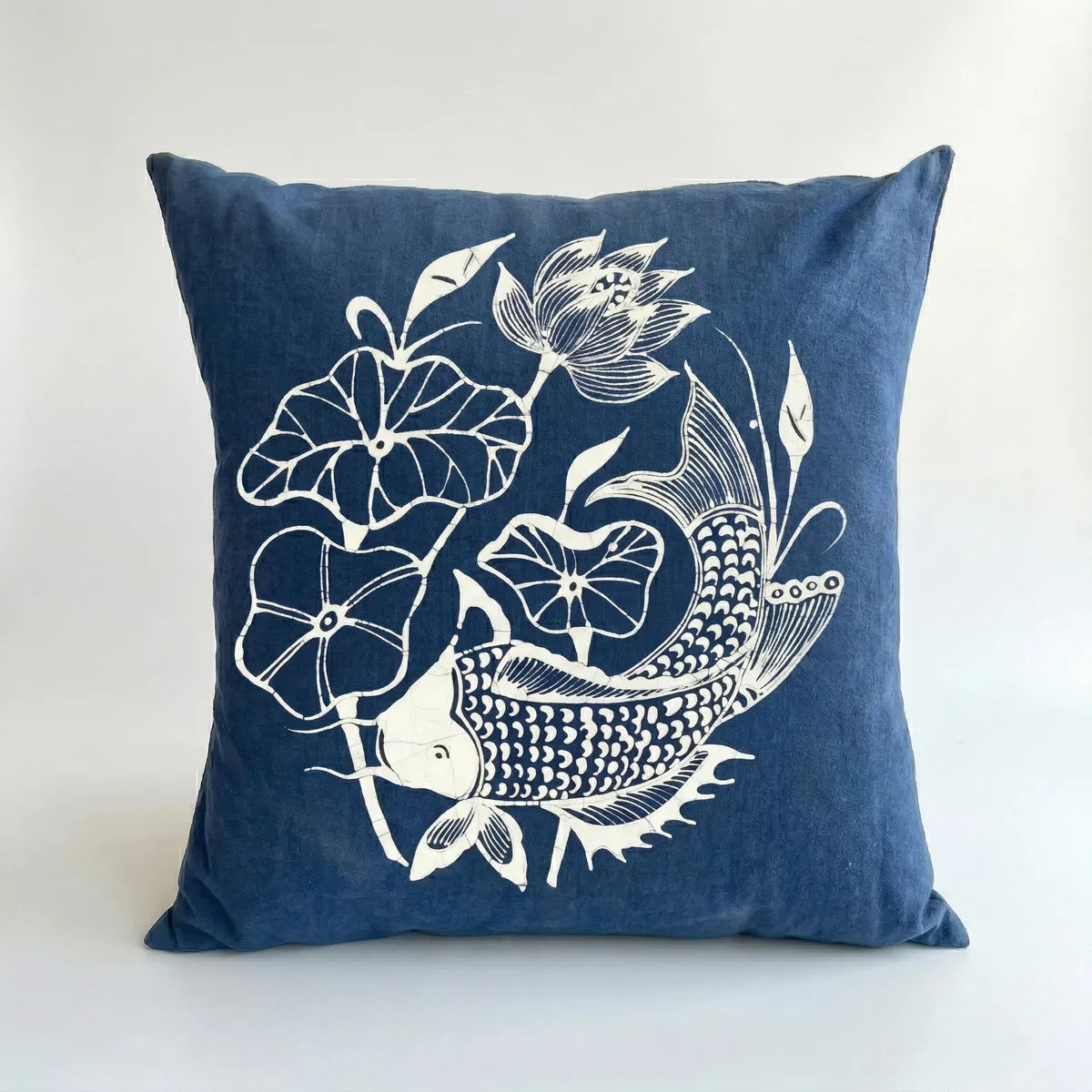 Miao batikpillow with white koi fish and lotus flower design on a white background