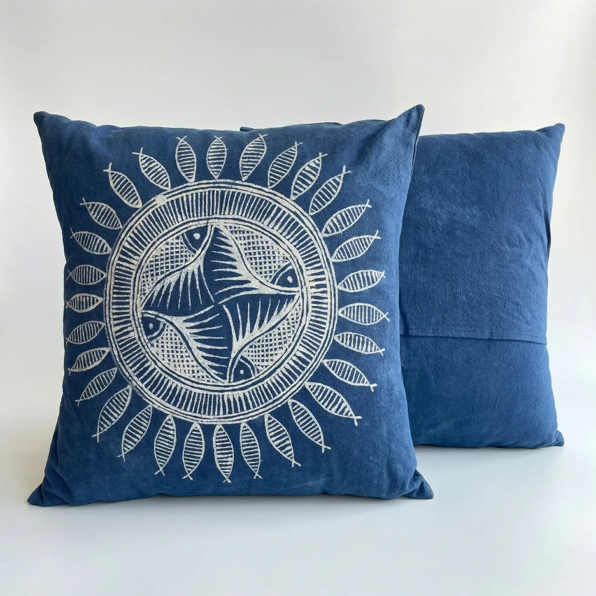 miao batik pillow with white decorative design on a plain background