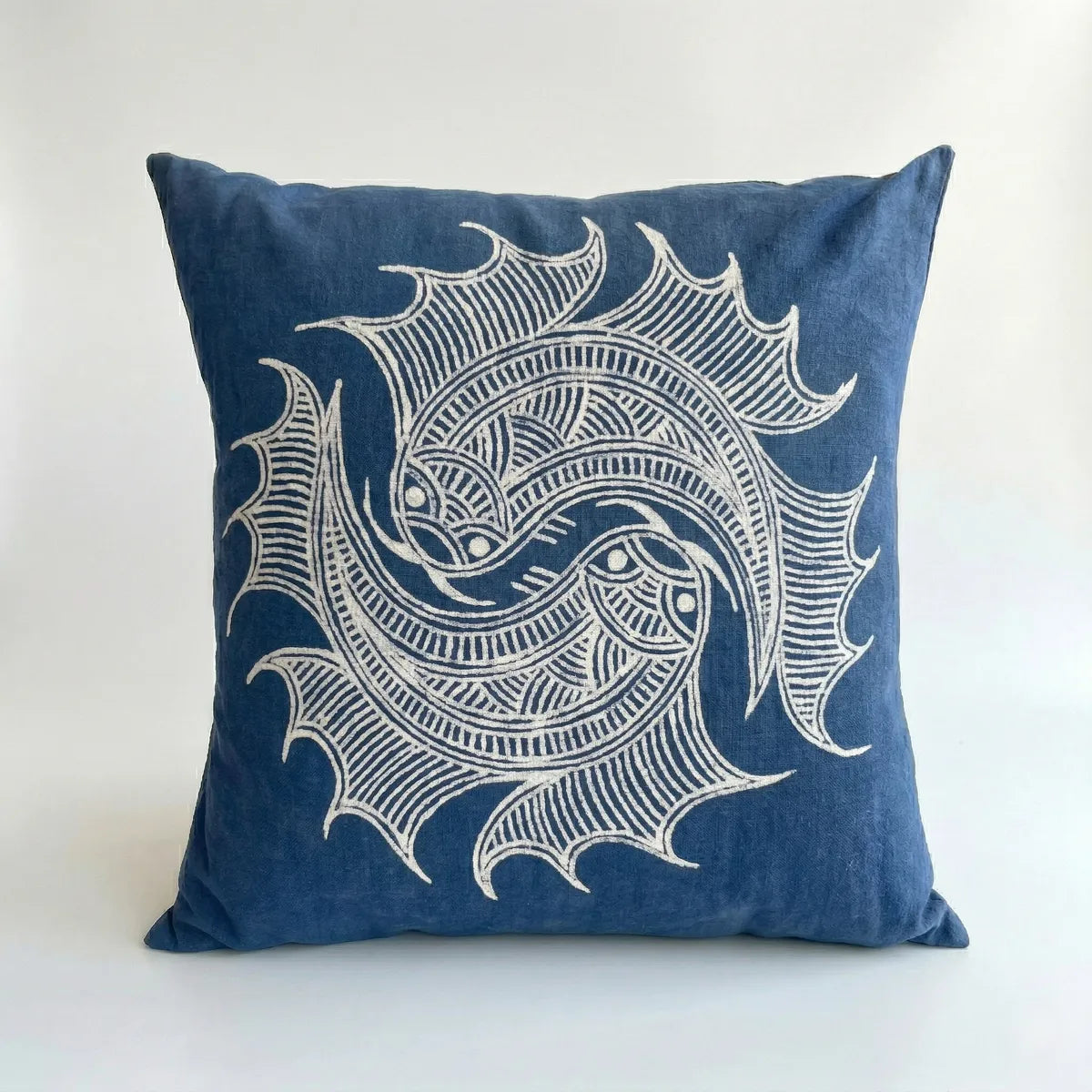 Miao batik pillow with white decorative pattern on a white background
