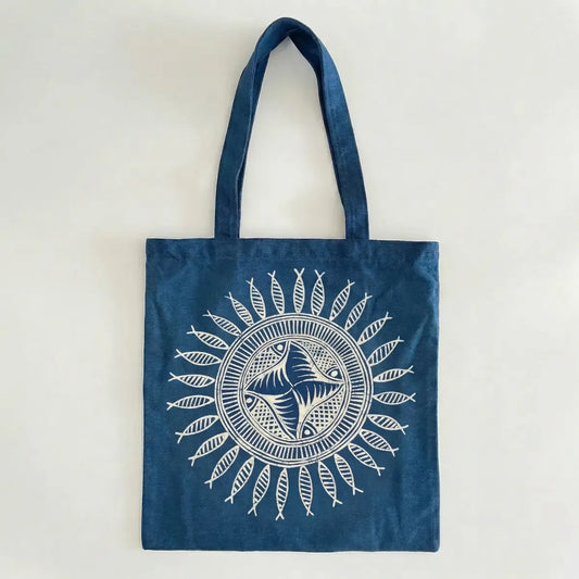 Miao batik tote bag with white fish design on a light gray background
