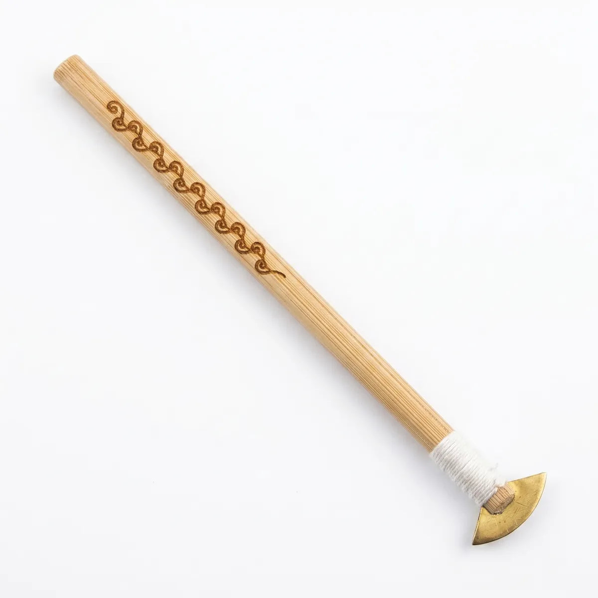Wooden Miao Batik tool with decorative carvings on a white background