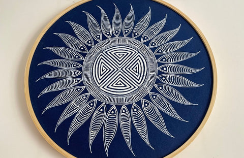 Miao batik sun pattern in white on indigo fabric