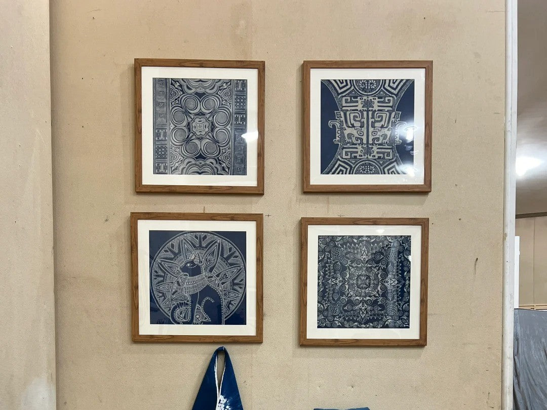 Small framed Miao batik textiles arranged as modern wall decor