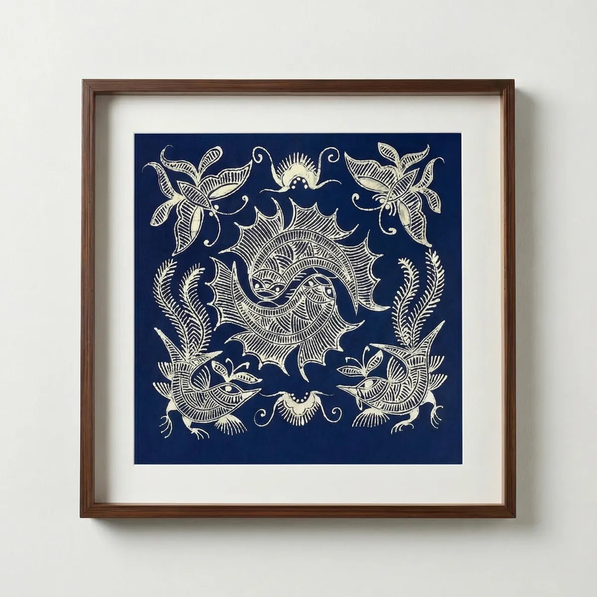 Framed Miao batik artwork with a blue and white abstract design on a white wall