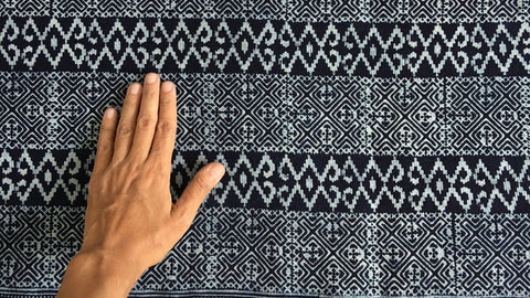 Vietnamese Hmong batik fabric showing repeated indigo pattern