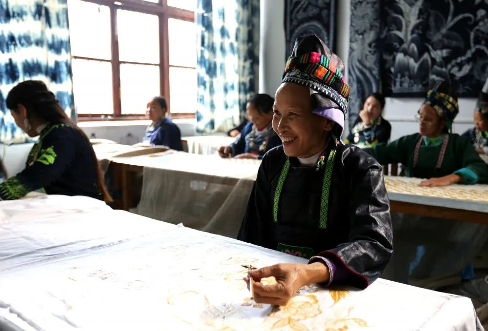 Miao batik artisans working together in studio