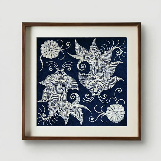 Framed Miao batik artwork with white fish and floral designs on a navy blue background