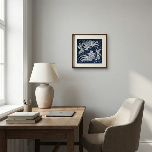 Home office with wooden desk, chair, lamp, and framed Miao batik artwork on the wall.