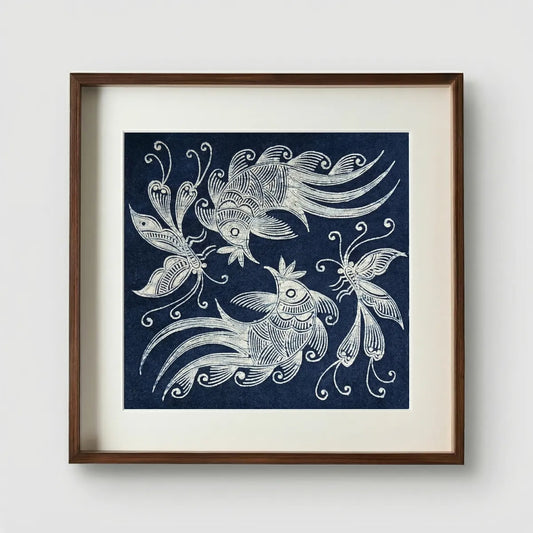 Framed Miao batik artwork of stylized fish on a blue background