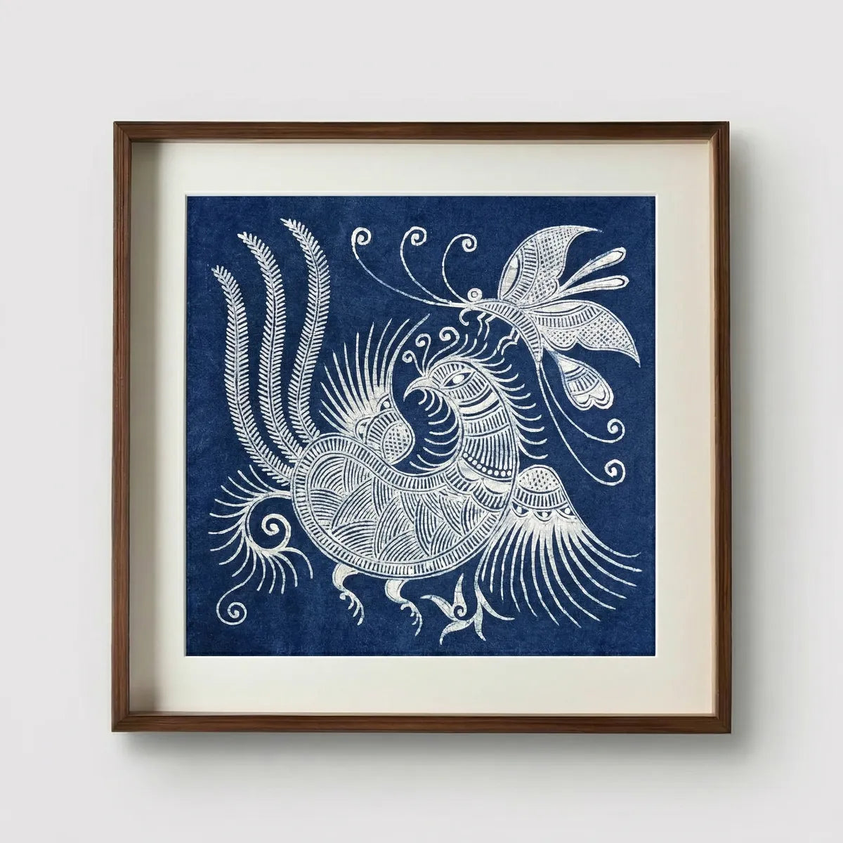 Framed Miaozu batik artwork of a white bird design on a blue background