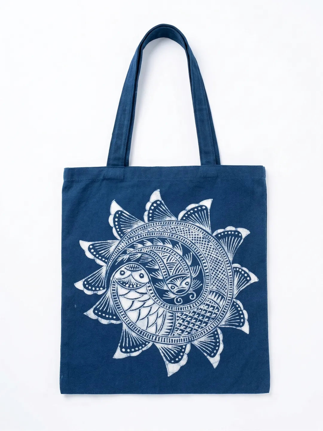 Navy blue Miaozu Batik tote bag with white sun design on a white background