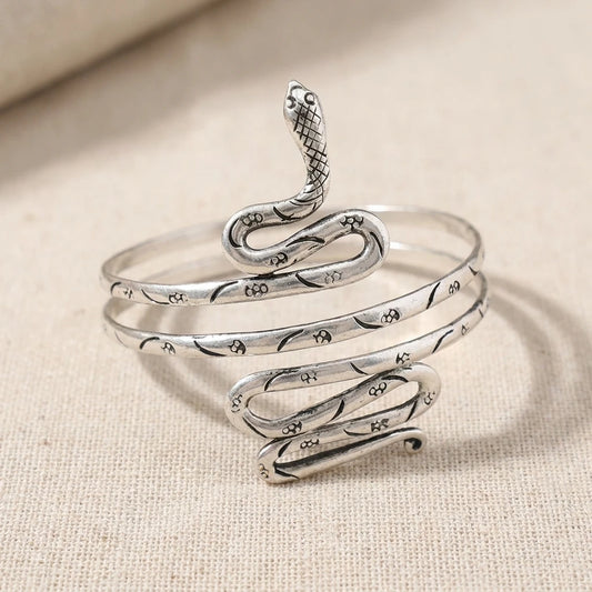 Miao Silver Coiled Snake Arm Cuff on a light background