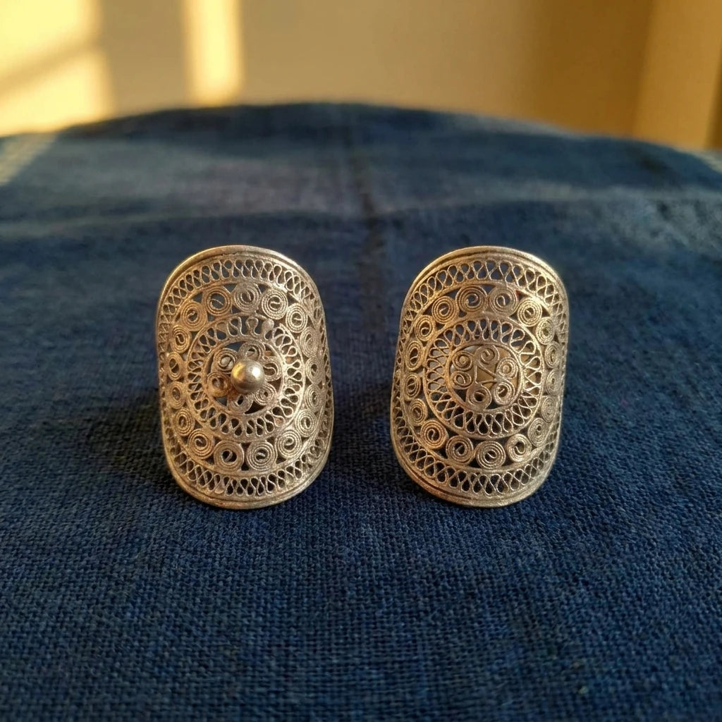 Miao Silver Filigree Statement Ring displayed on indigo textile