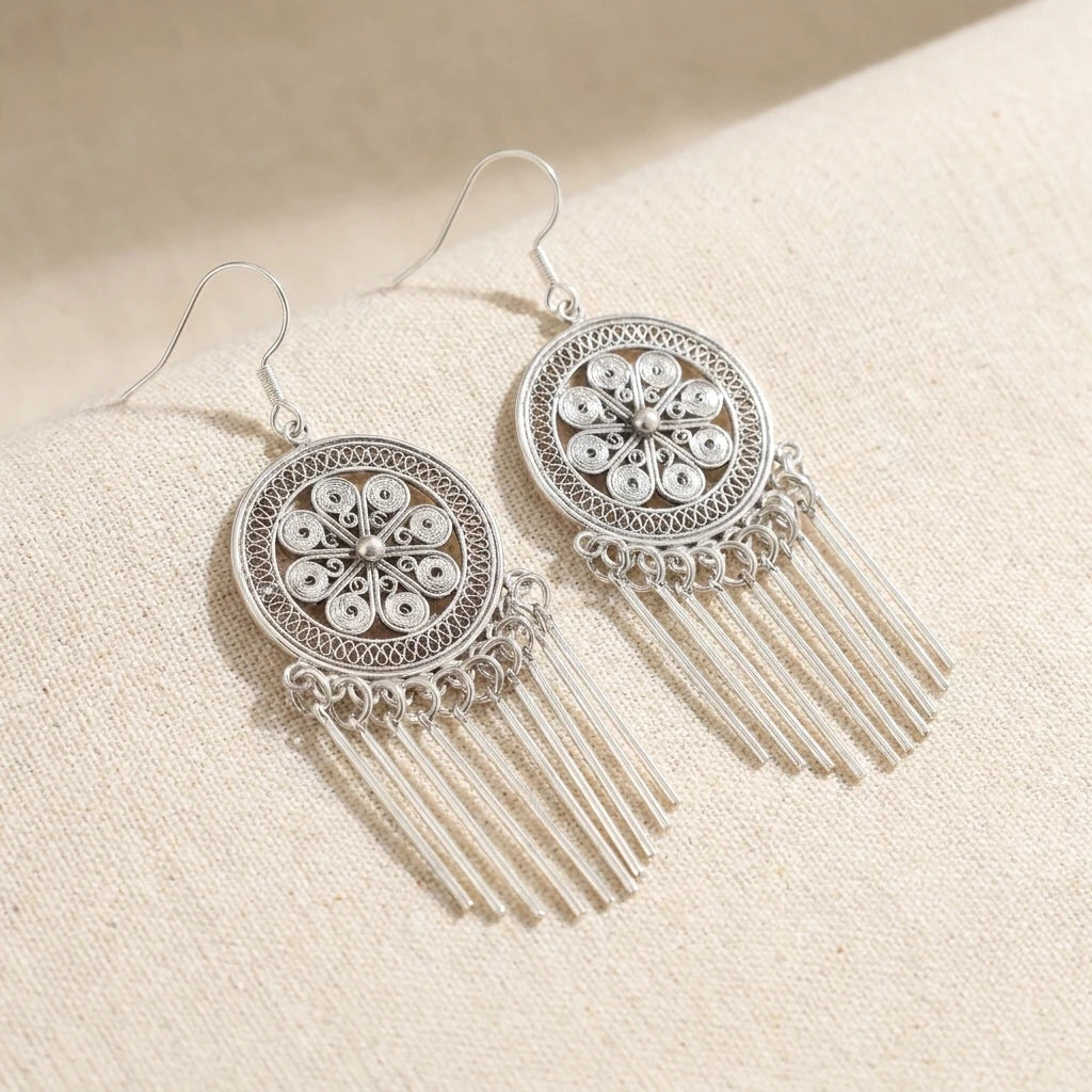 Miao Silver Filigree Tassel Earrings on a light background