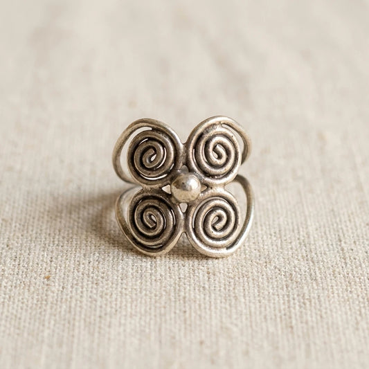Miao Silver Four-Spiral Adjustable Ring on a light background