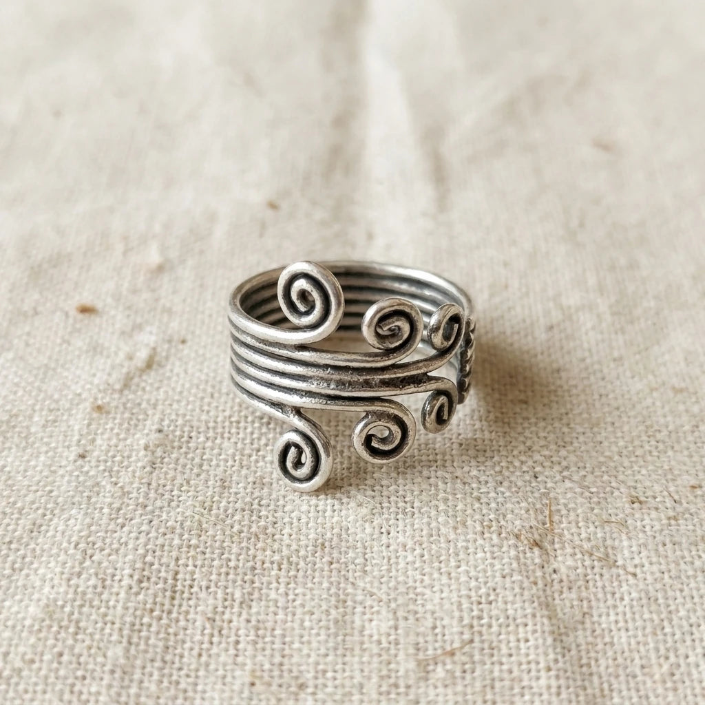 Miao Silver Tall Spiral Adjustable Ring on a light background