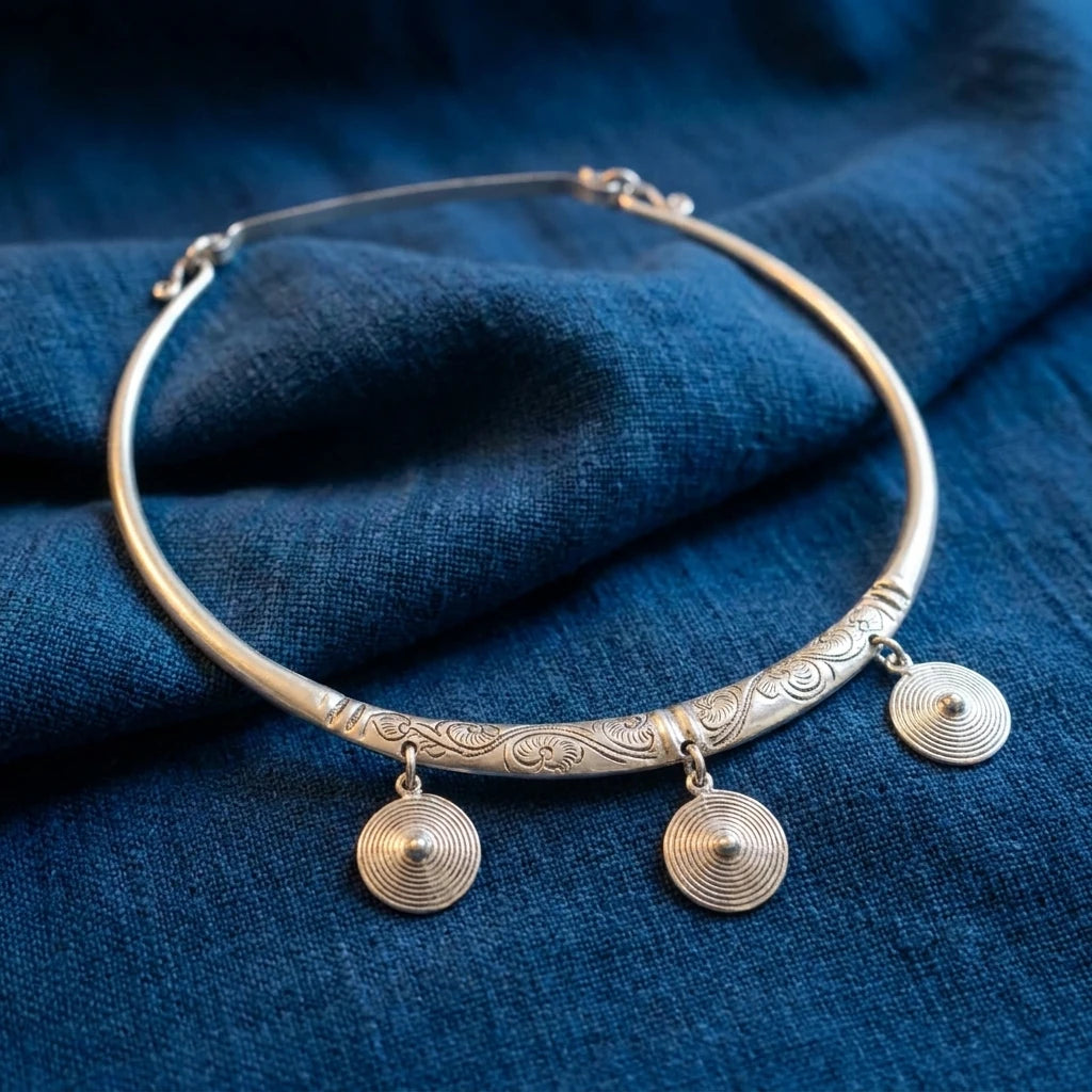 Miao Silver Three-Disc Collar Necklace displayed on indigo textile